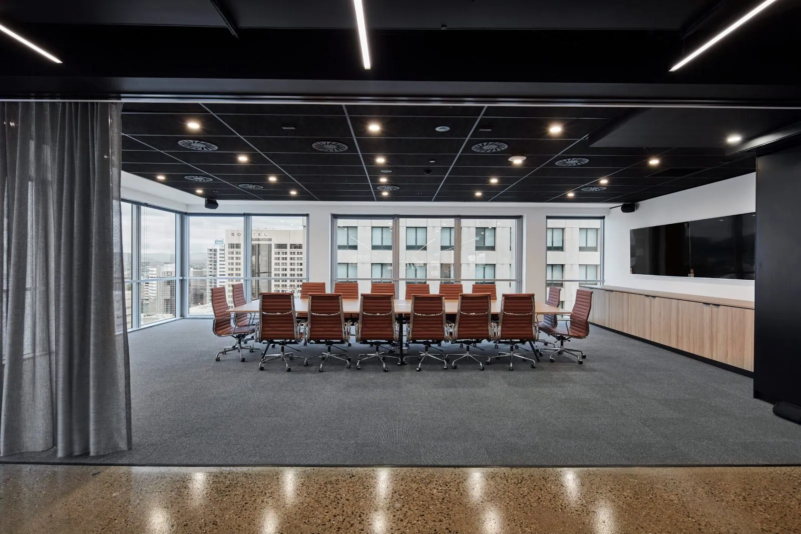 Polished concrete floor in a Brisbane commercial boardroom fit-out by OzGrind