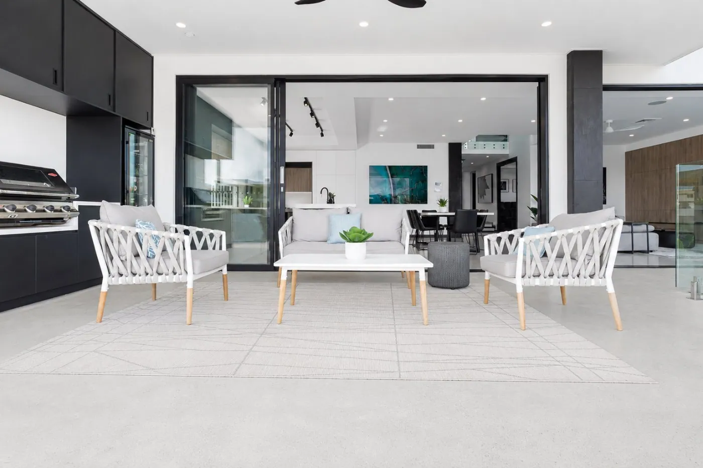 Honed concrete alfresco and outdoor entertaining area at a modern Brisbane home