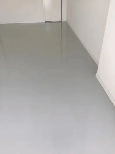 Rolling the solid colour epoxy base, Brisbane