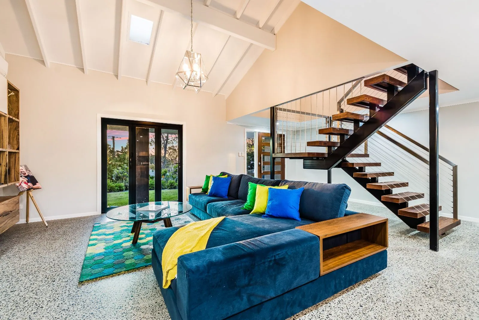 Polished concrete floor and floating staircase in a living room, Alexandra Hills Brisbane