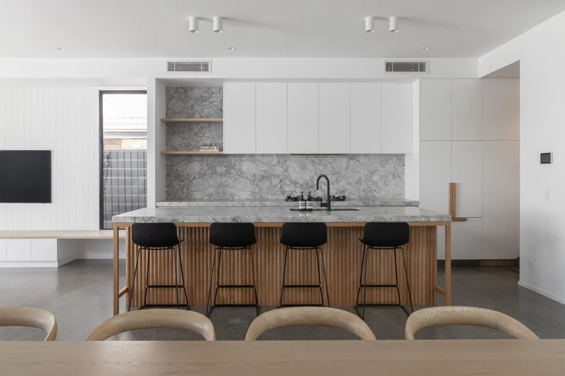 Front on view of the marble topped kitchen island and polished concrete floor at the Eclat Building home, Hendra