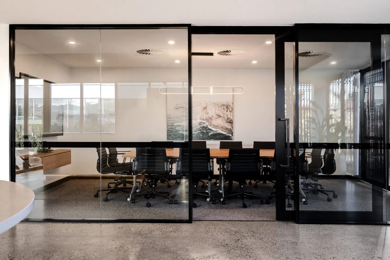 Grind and seal polished concrete floor in a boardroom off the polished concrete floor at the Archway commercial office fit-out, Brisbane
