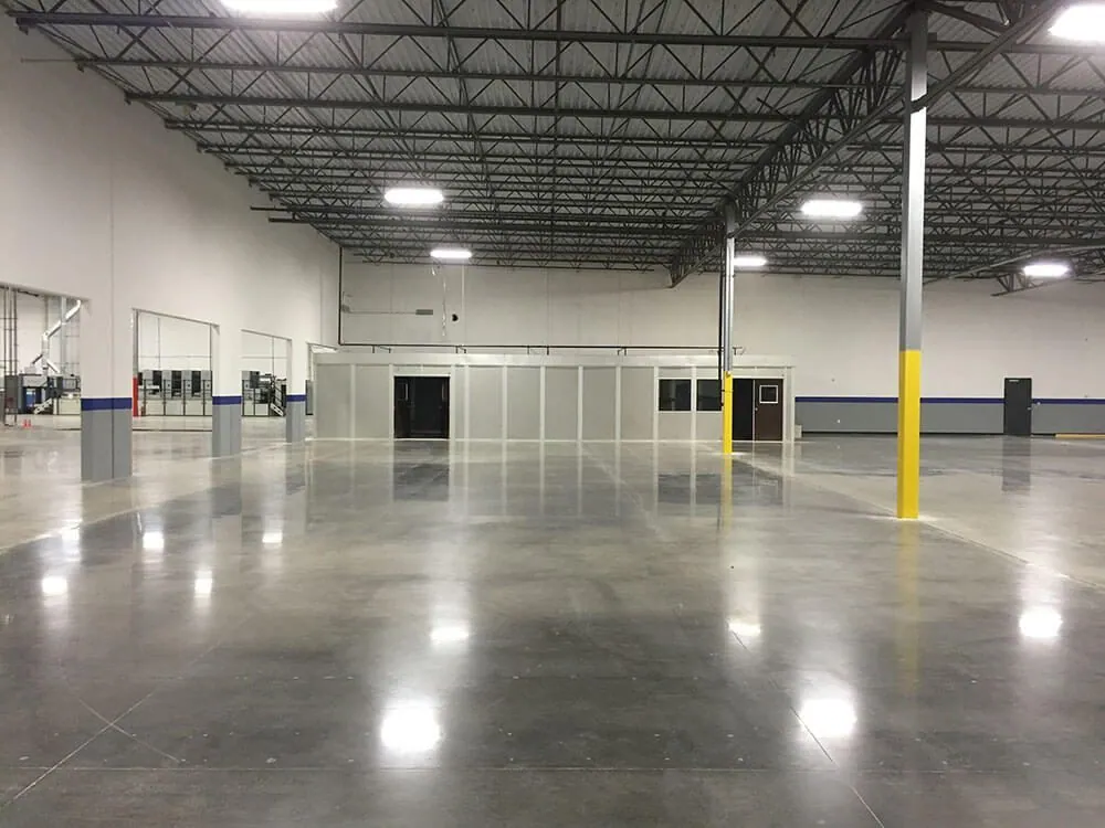 Restored polished warehouse concrete floor after a make good