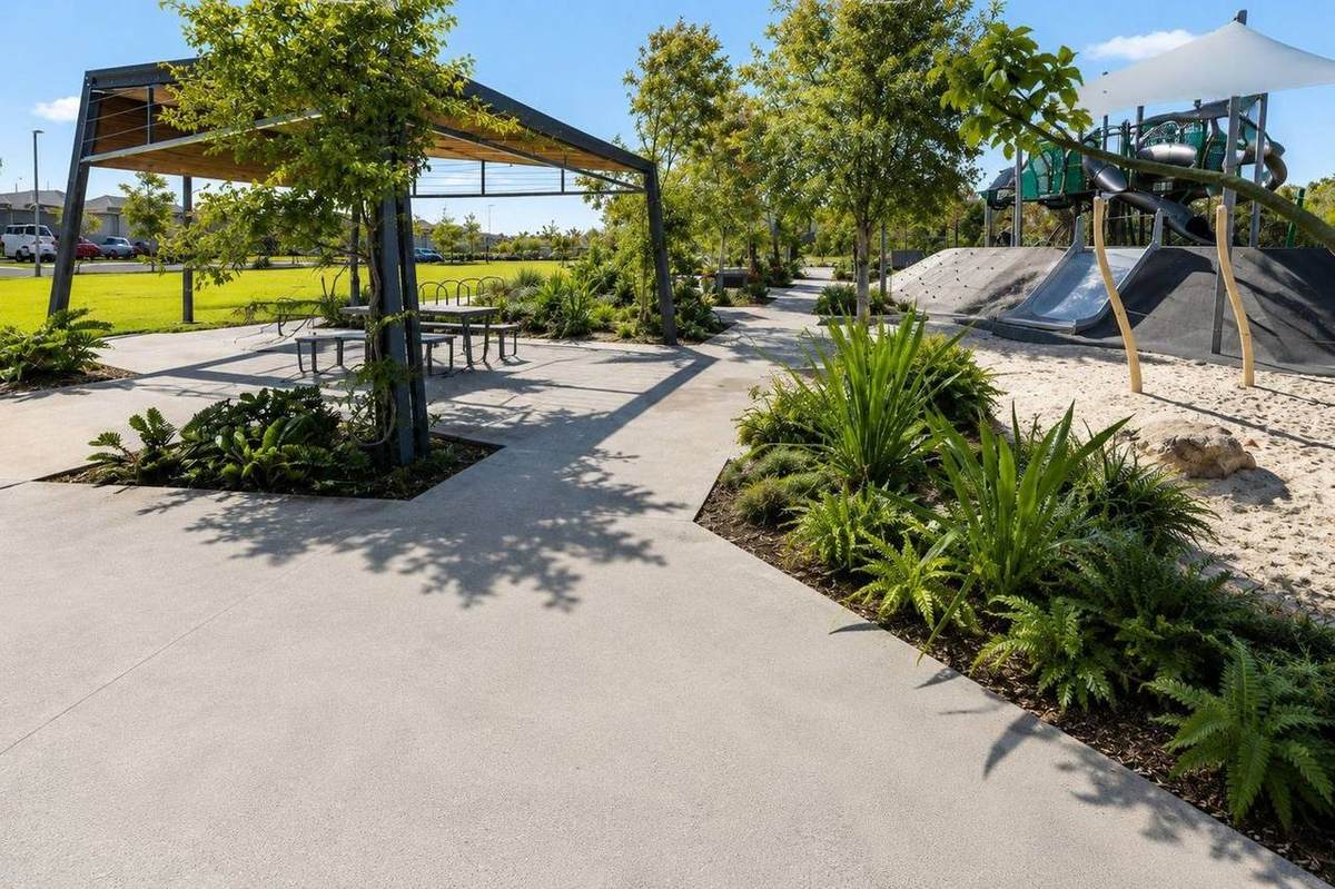 Commercial honed concrete walkway and entry at a Brisbane public library, slip-rated outdoor finish