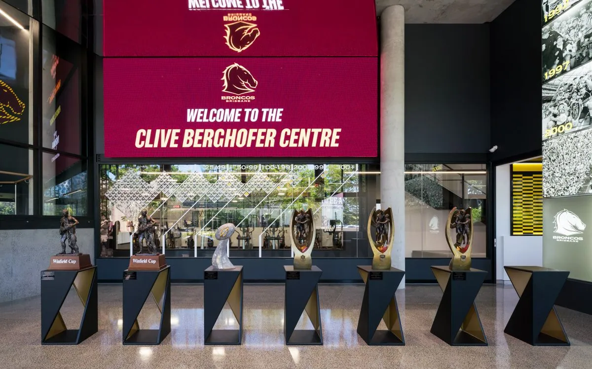 Grind and seal concrete floor beneath the welcome screen and premiership trophies at the Brisbane Broncos Clive Berghofer Centre, Red Hill