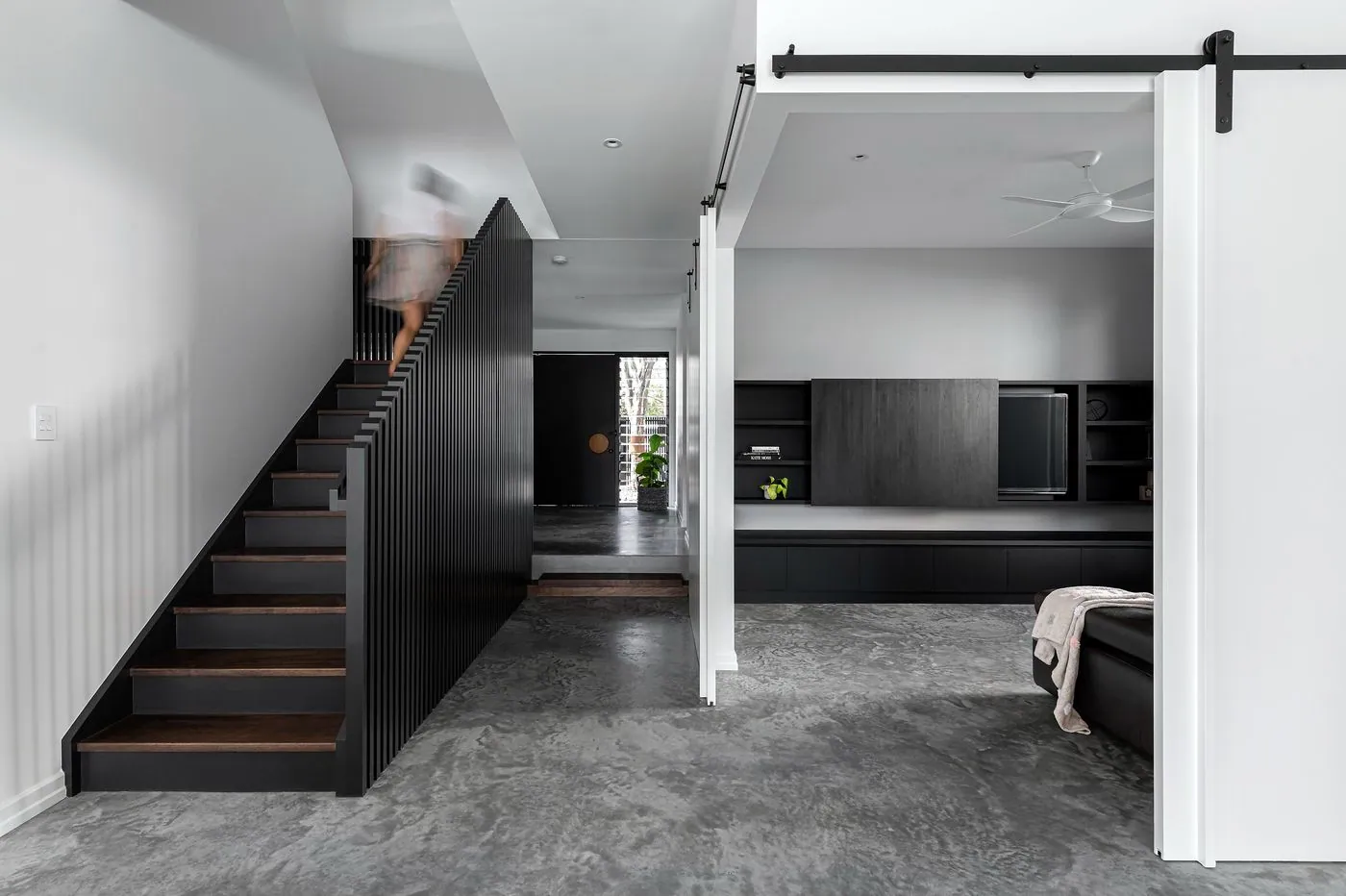 Polished concrete floor in a Brisbane home with staircase