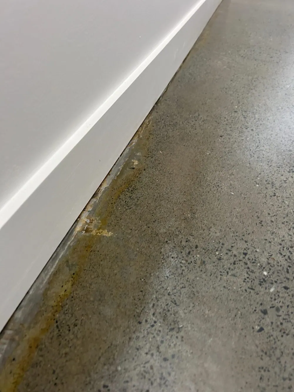 Moisture and staining along an edge