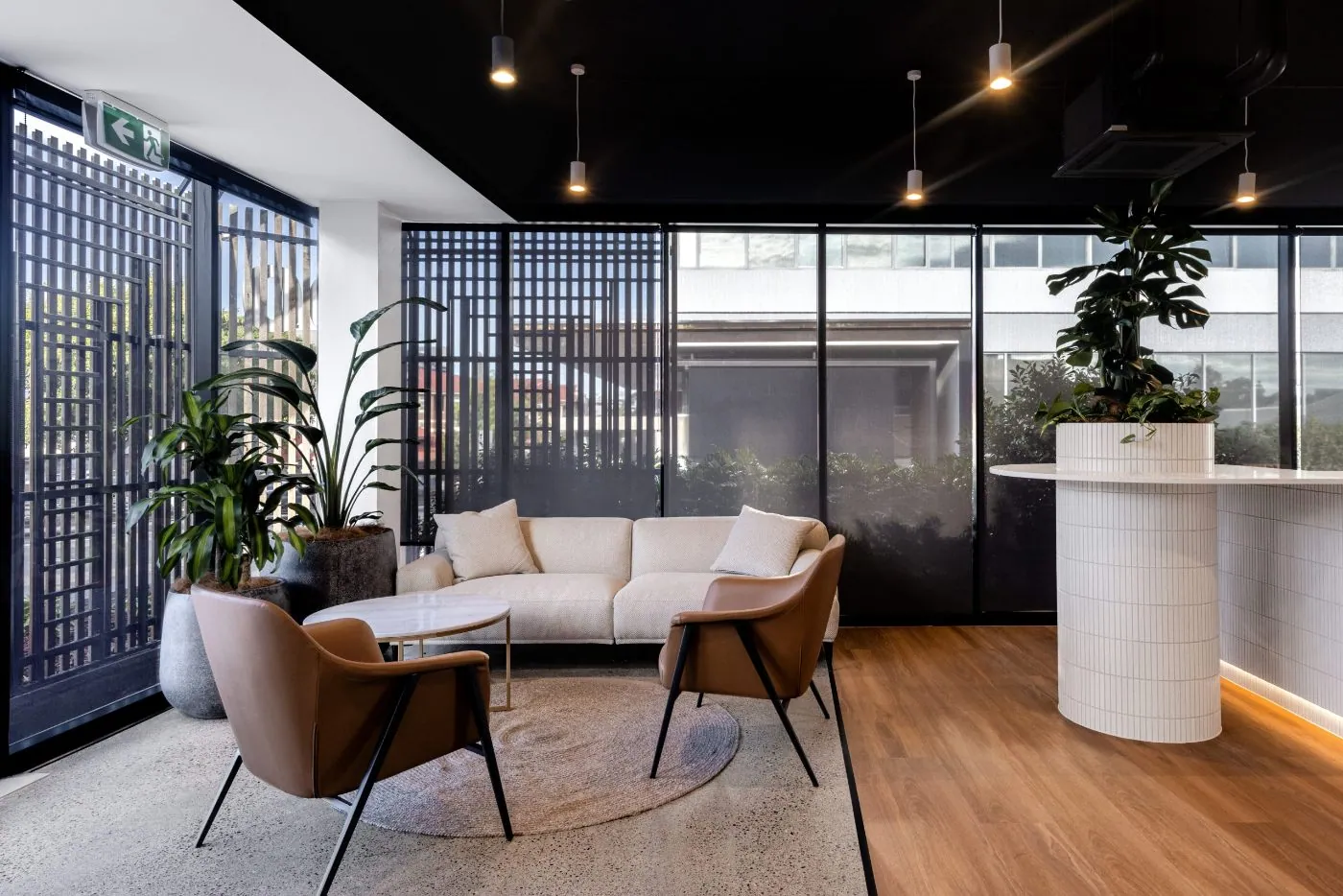 Grind and seal polished concrete floor in a light-filled office lounge, Brisbane