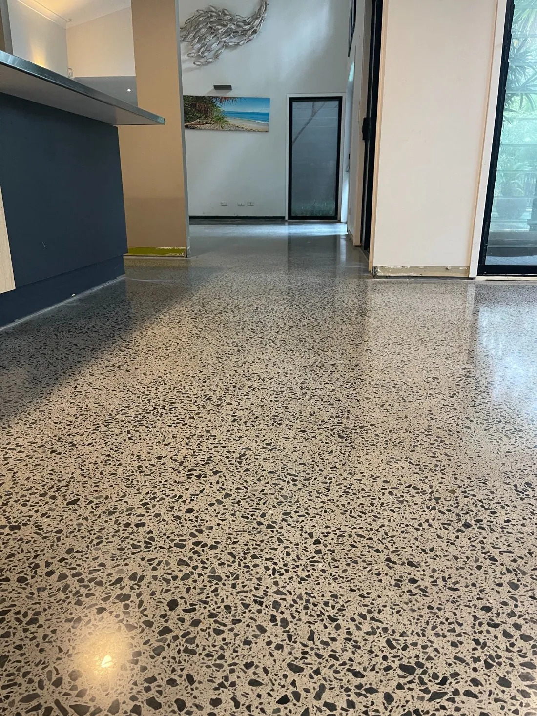 Mechanically polished concrete floor with a high sheen in a hotel lobby by OzGrind in Brisbane