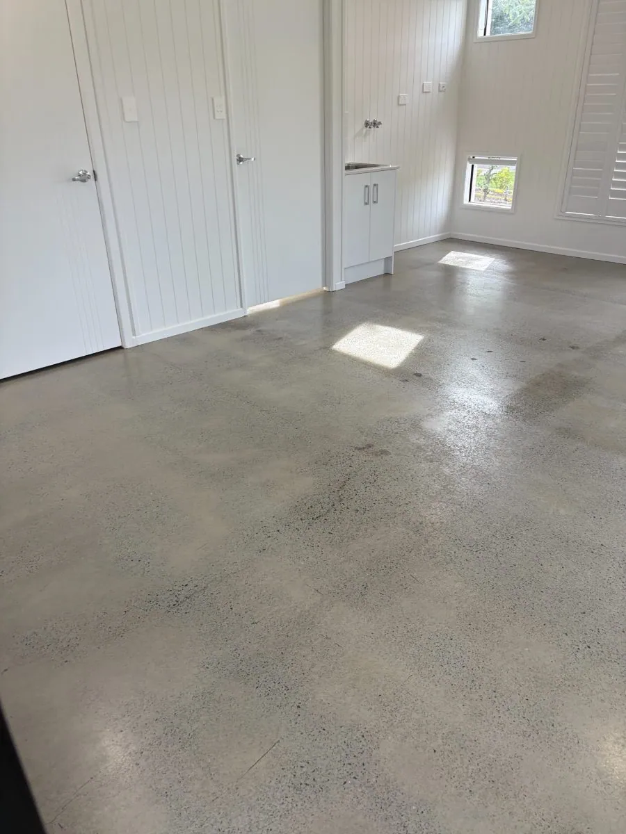 Light grey minimal-exposure hybrid polished concrete floor by OzGrind in Brisbane