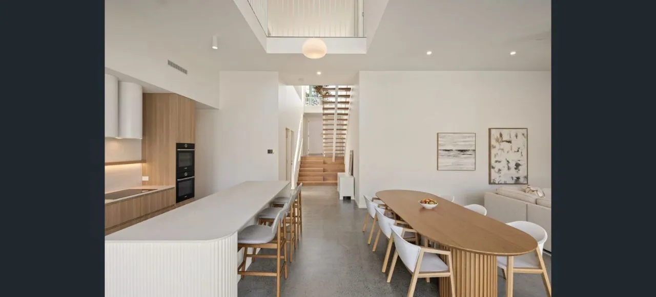 MPC matte polished concrete in a white open-plan kitchen and dining