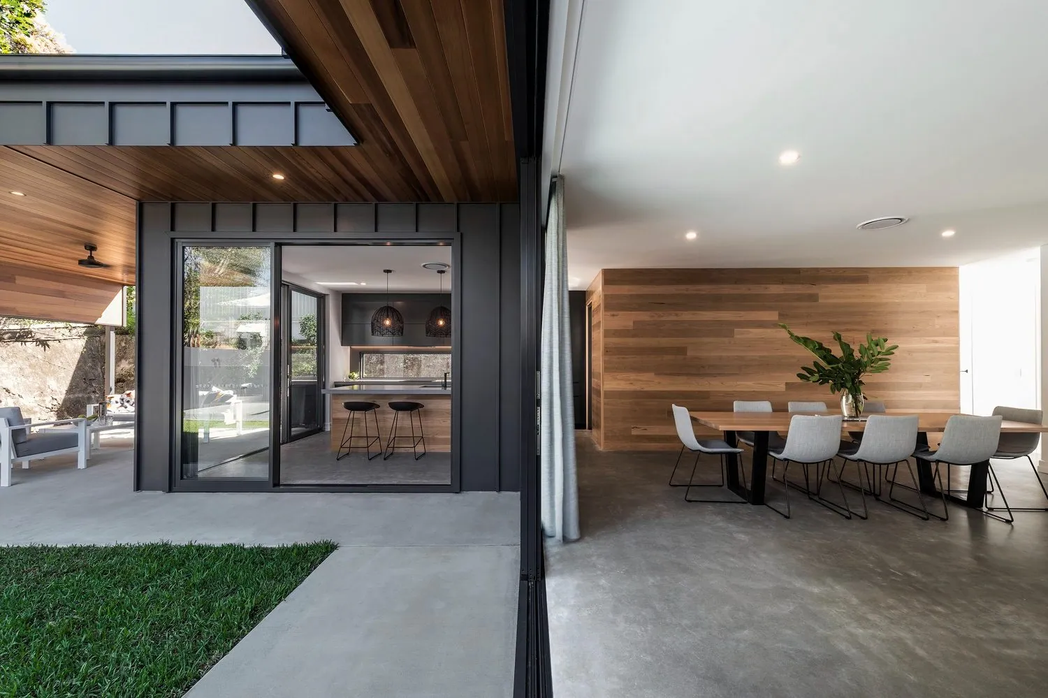 Honed and polished concrete floor flowing from the open plan living out to the pool at the Michael and Carlene Duffy house, as seen on Ready Set Reno