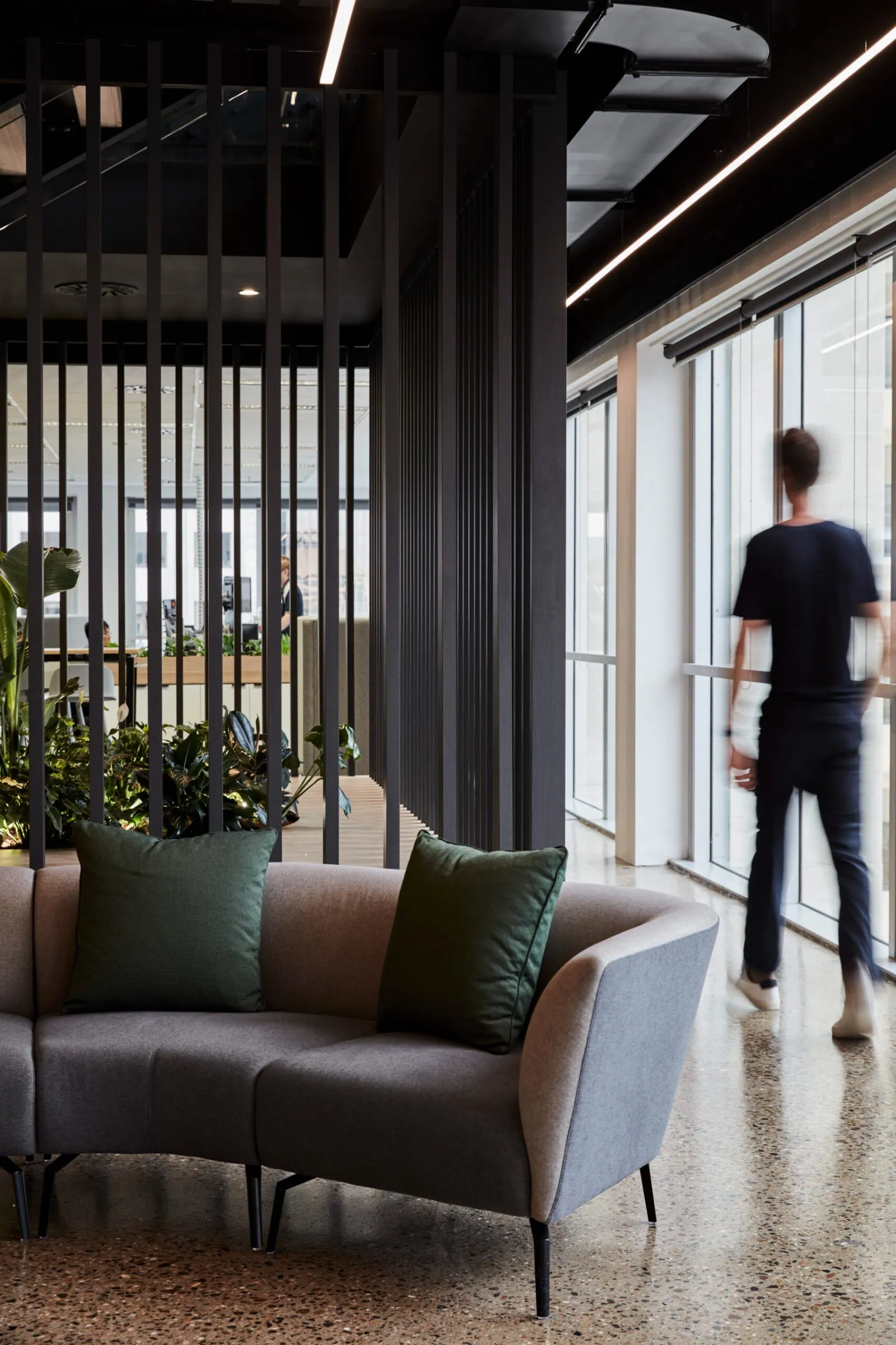 Grind and seal polished concrete floor in an office lounge walkway at the Archway commercial office fit-out, Brisbane