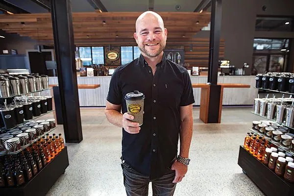 Zarraffas Coffee founder in the retail store on an OzGrind polished concrete floor, Brisbane