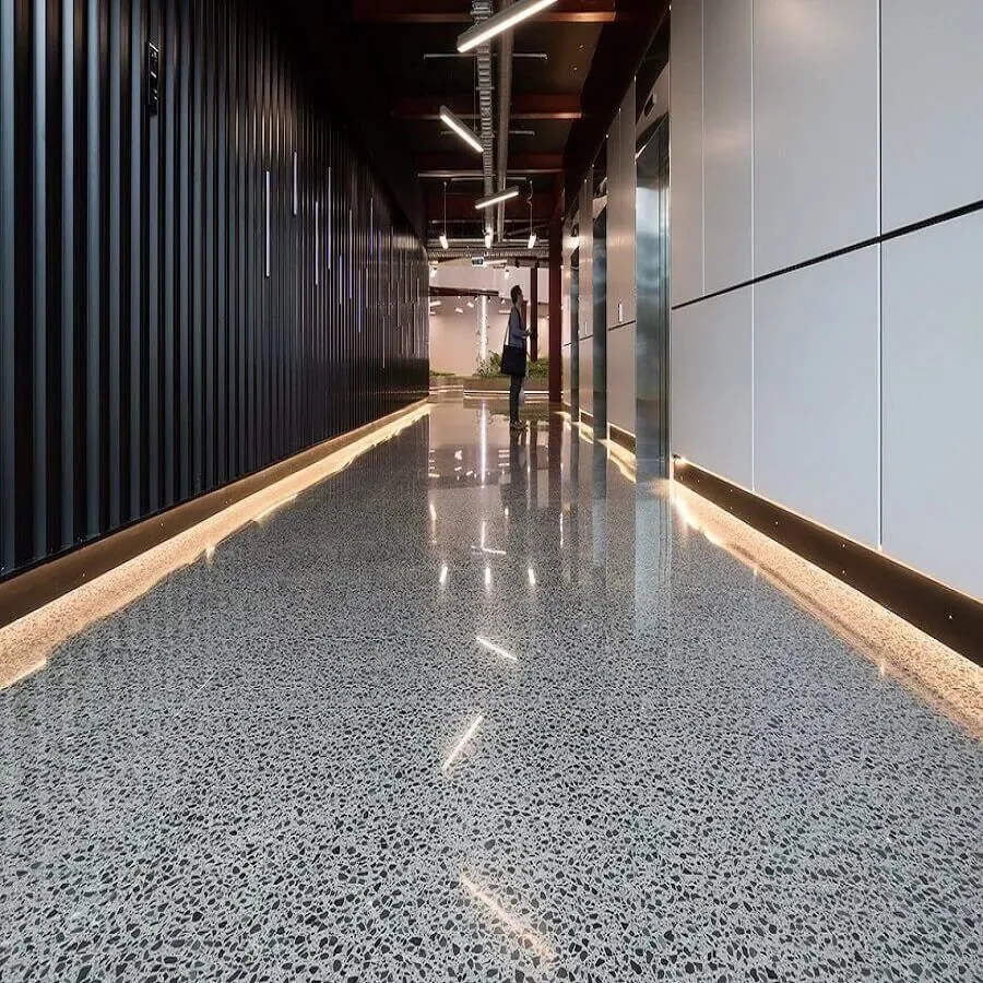 MPC high-gloss polished concrete floor in a corridor with exposed aggregate