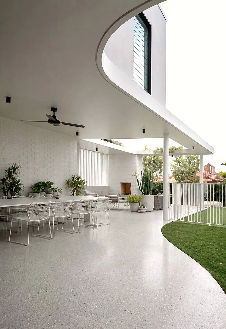 White honed concrete (Icelandia mix) outdoor entertaining area at a modern Brisbane home