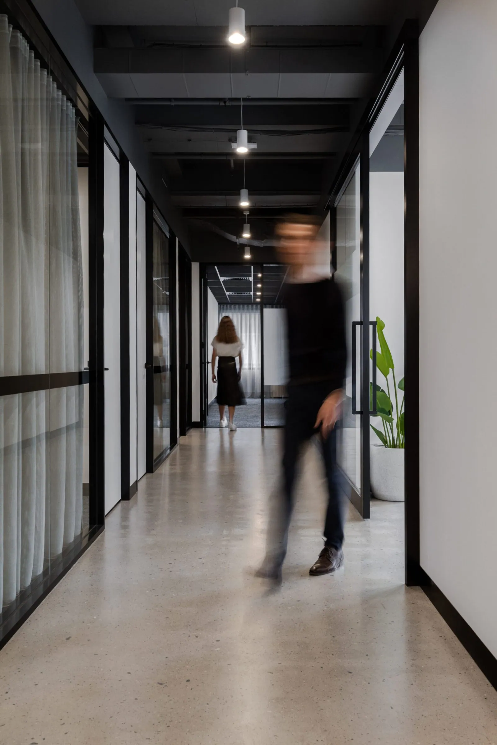 Grind and seal polished concrete floor in a polished concrete office corridor at the Archway commercial office fit-out, Brisbane
