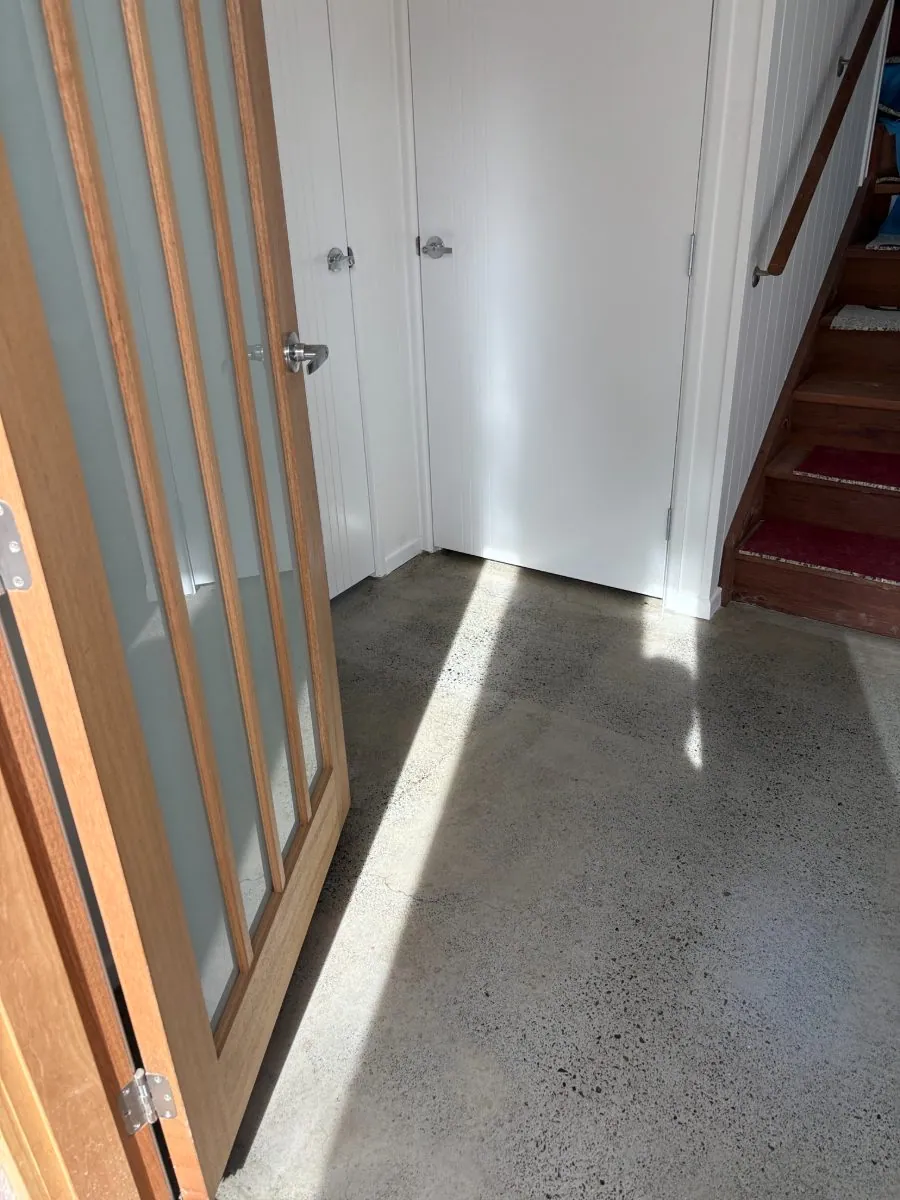 Pale minimal-exposure hybrid polished concrete entry floor by OzGrind in Brisbane