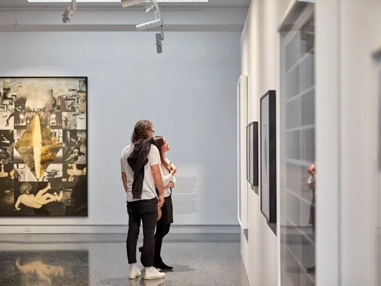 Visitors viewing artworks on a polished concrete floor at Murray Art Museum Albury