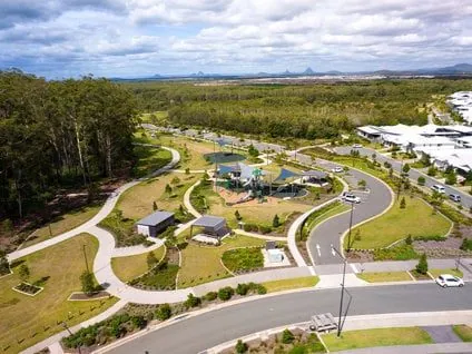 Panorama of honed concrete paths and picnic areas in the Stockland Aura parkland, Bells Creek