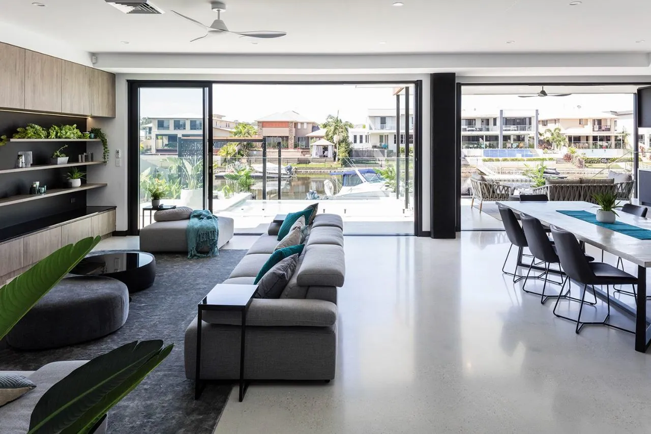 MPC semi-gloss polished concrete in a canal-front open-plan living and dining