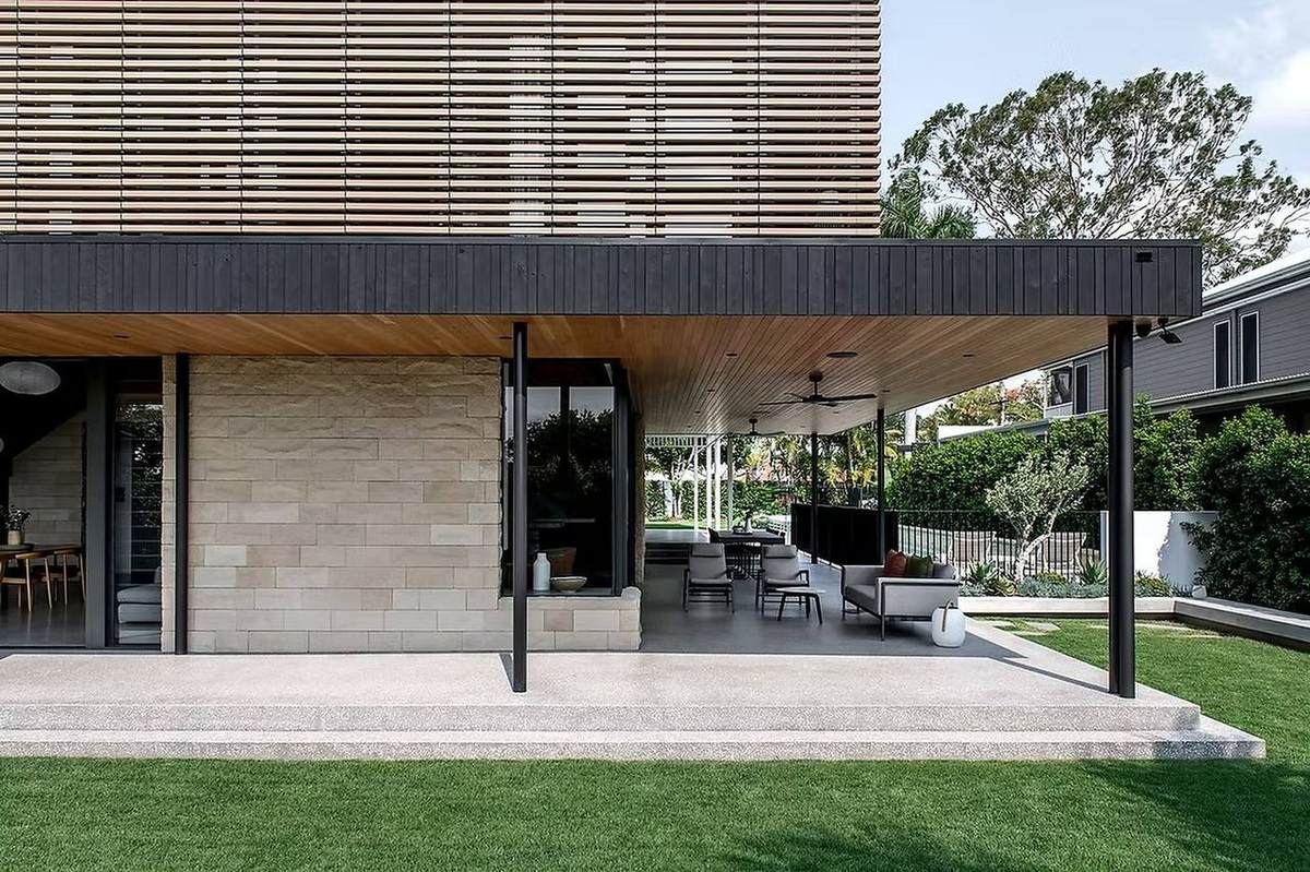 Honed concrete steps and outdoor entertaining area at a modern Brisbane home