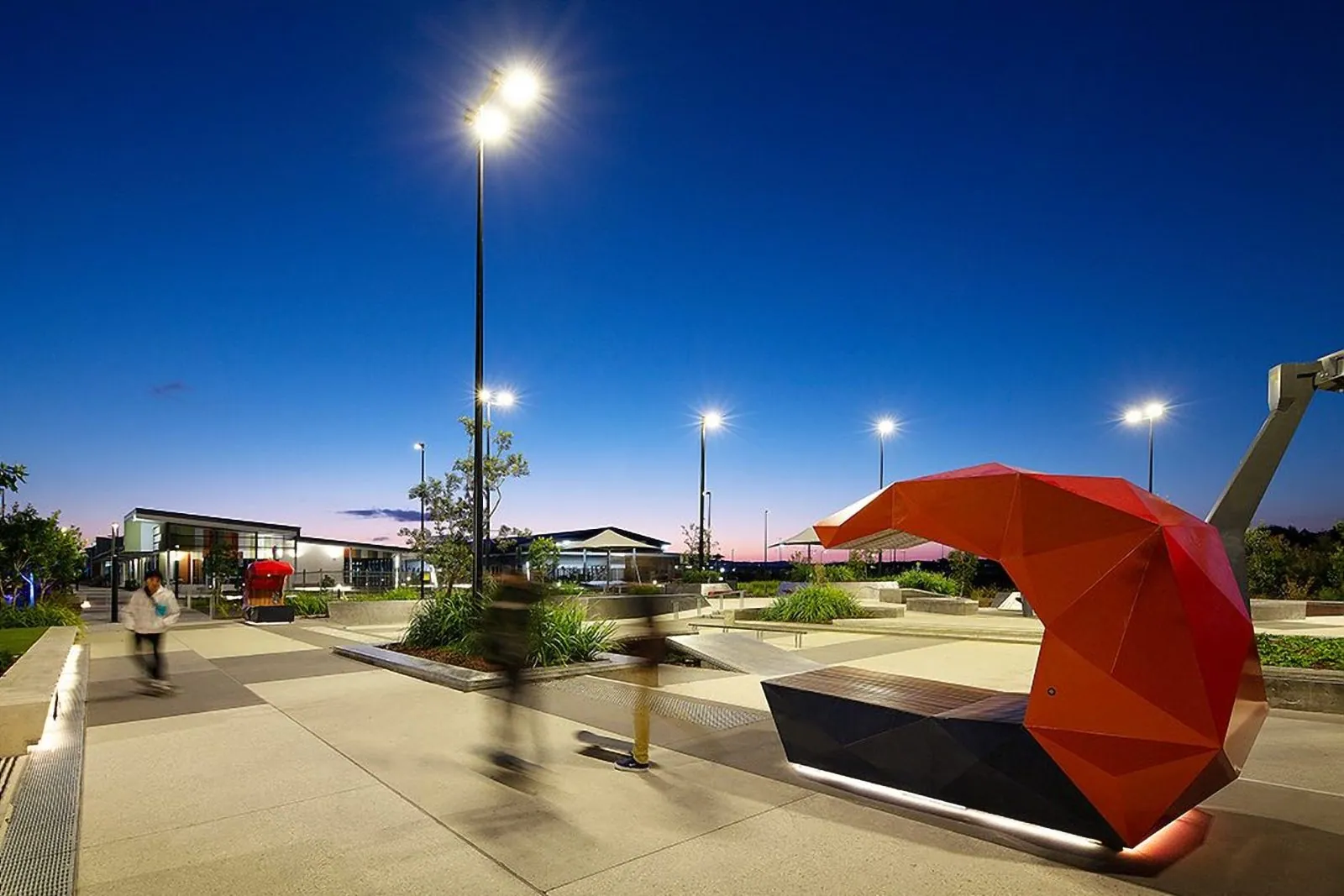 Aerial view of honed concrete paths around the playground at Stockland Aura, Baringa