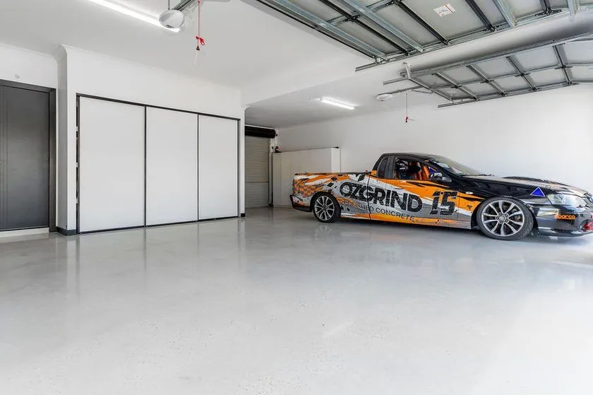 Polished concrete garage floor Brisbane Light grey polished concrete garage floor with the OzGrind race ute in a Brisbane garage