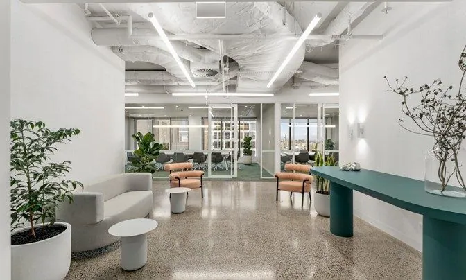 Grind and seal gloss concrete in a bright white office lobby