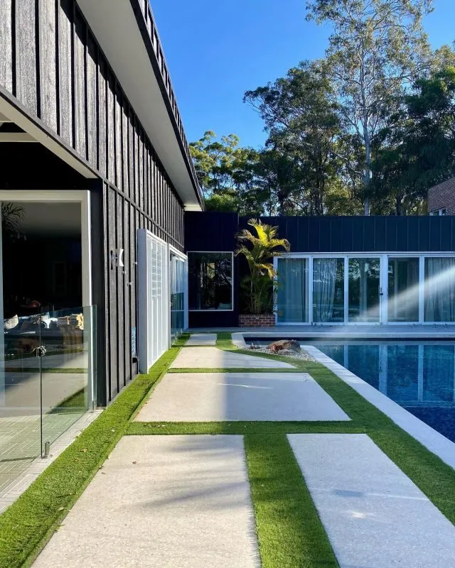 Outdoor polished concrete pool surround with turf inlays at the Duffy house, as seen on Ready Set Reno