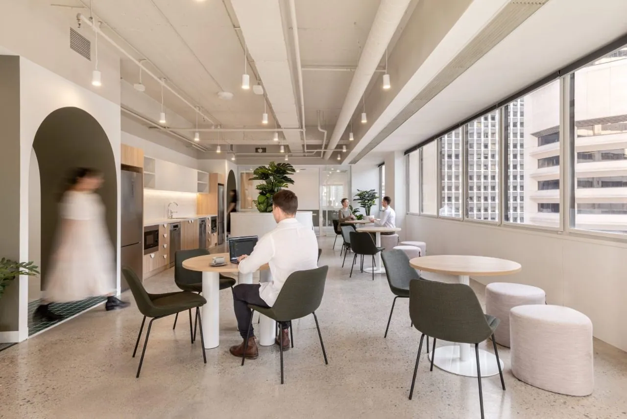 Minimal exposure polished concrete in a city office breakout space