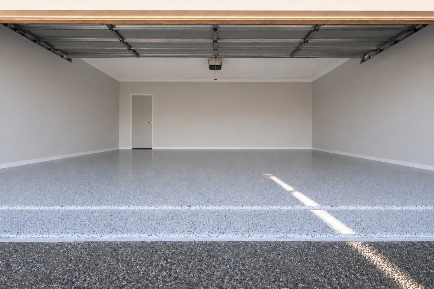 Grey flake epoxy garage floor in a Brisbane home, OzGrind