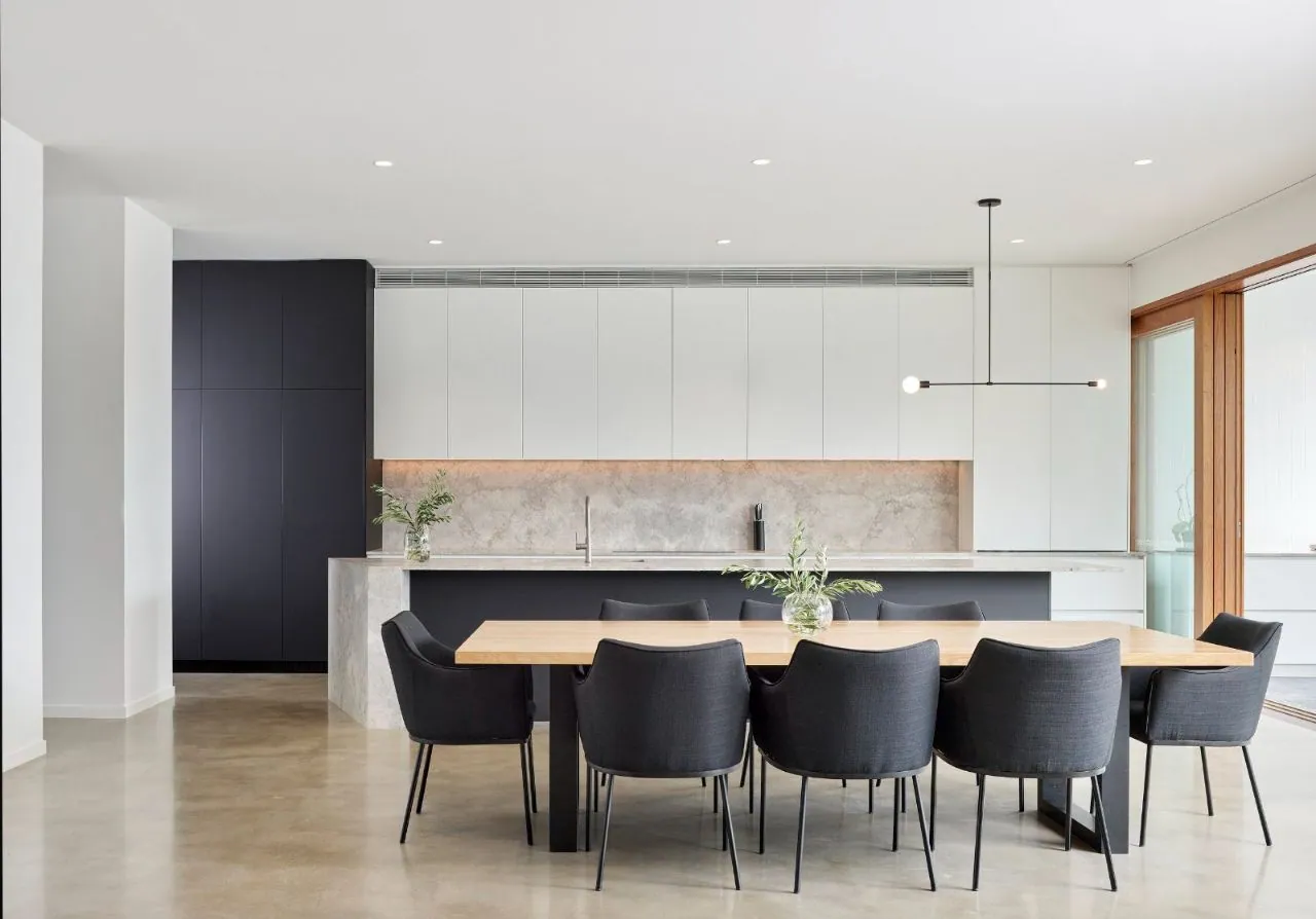 Nil exposure polished concrete floor in a modern kitchen and dining space