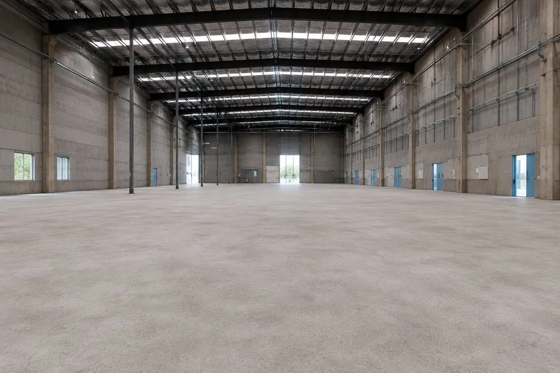 Concrete grinding and floor preparation in a warehouse