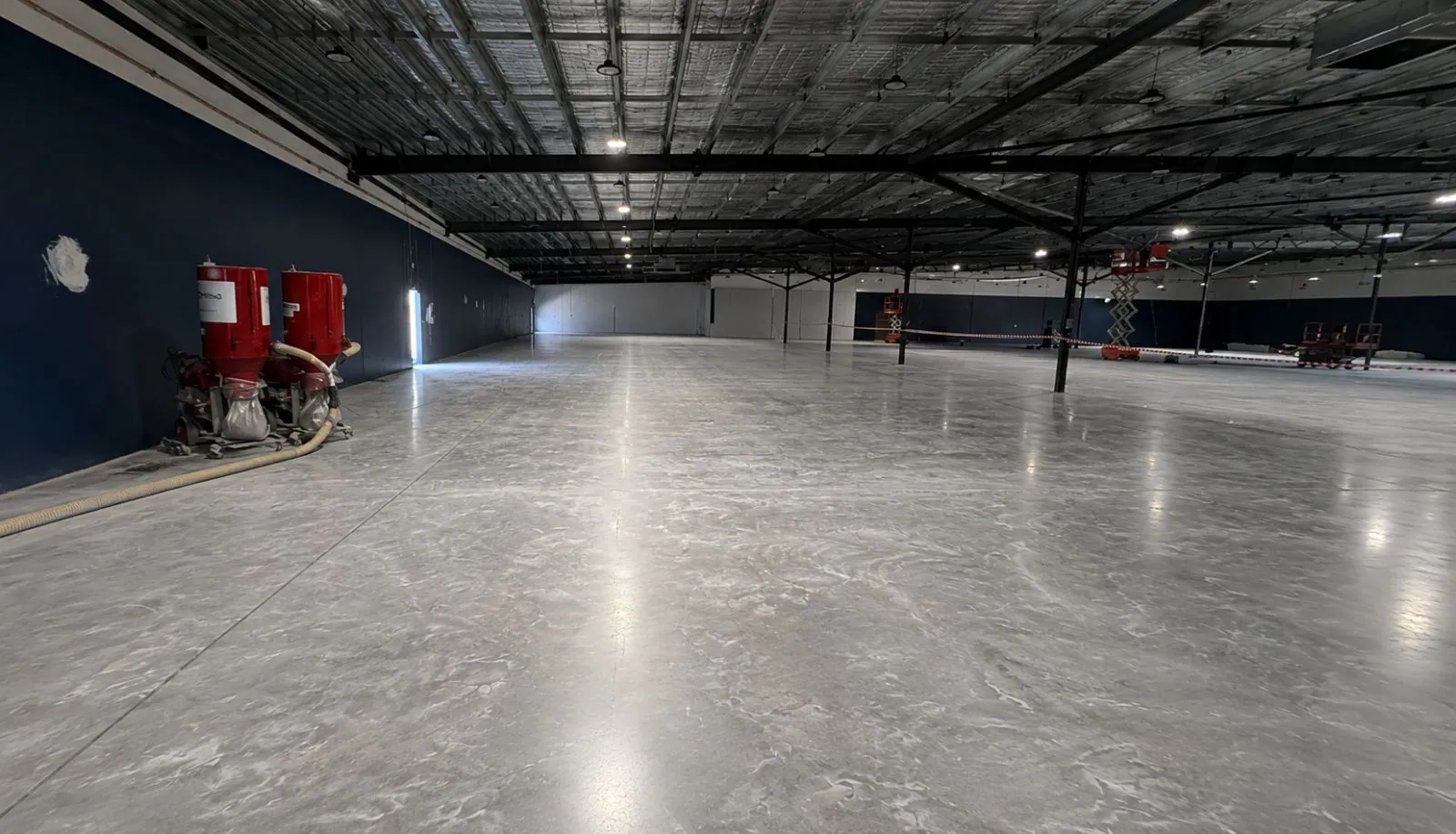 Polished warehouse floor after a make good with dustless extraction gear