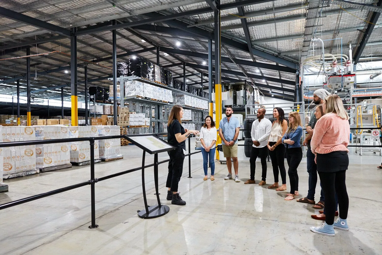 Polished concrete industrial floor in the Zarraffas Coffee roastery and processing plant during a staff tour, Brisbane