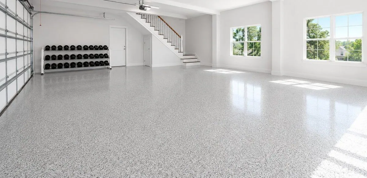 Epoxy flake garage floor in a Brisbane home with home gym and staircase