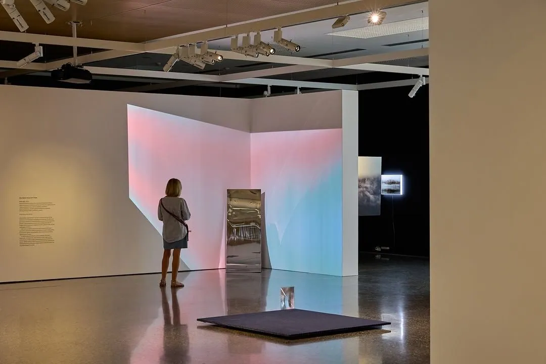 Coloured light installation reflected in the polished concrete floor at Murray Art Museum Albury