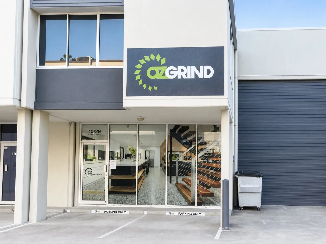 OzGrind polished concrete showroom storefront at 10/29 Lukin Drive, Eagle Farm Brisbane