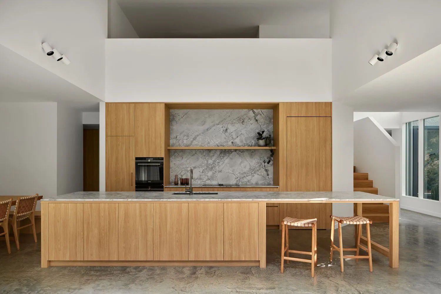 Polished concrete floor in a Brisbane home kitchen with island bench