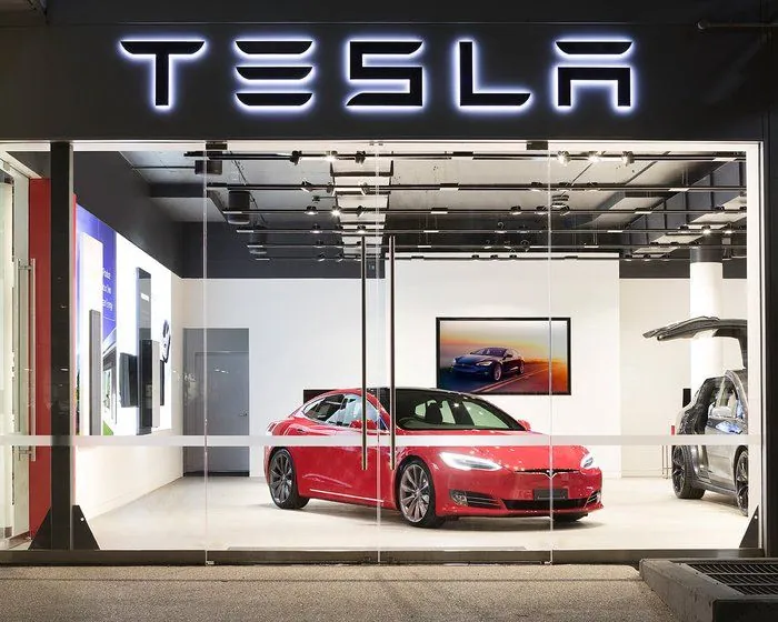 Tesla showroom polished floor Red Tesla Model S in a showroom on a polished concrete floor