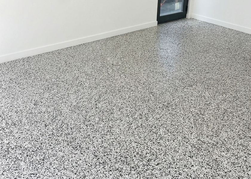 Flake epoxy garage floor Brisbane Black and white flake epoxy garage floor with a high-gloss finish in a Brisbane garage
