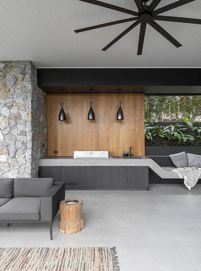 Honed concrete outdoor kitchen and BBQ area at a Brisbane home