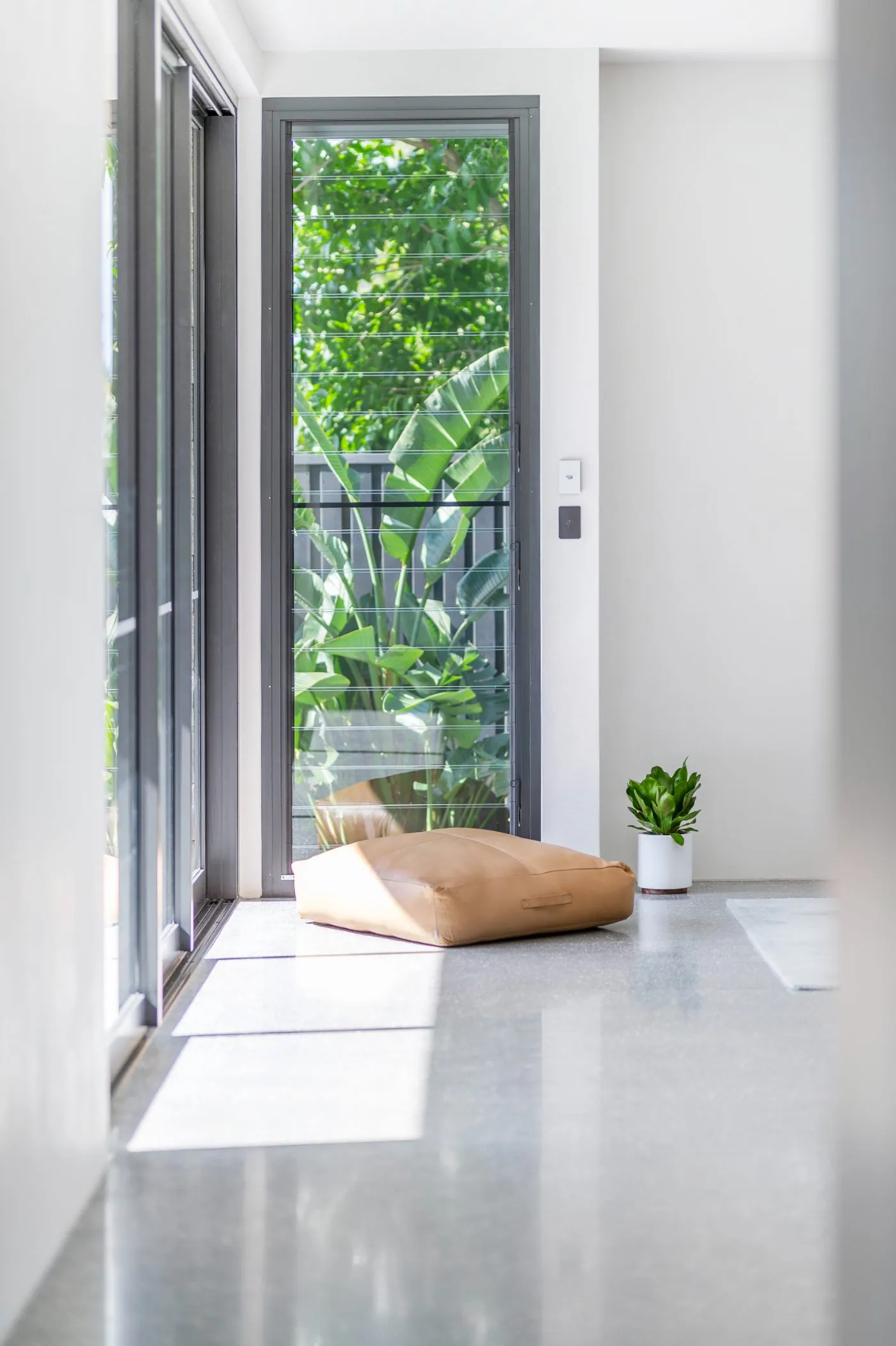 Indoor polished concrete kitchen and living floor in a Brisbane home