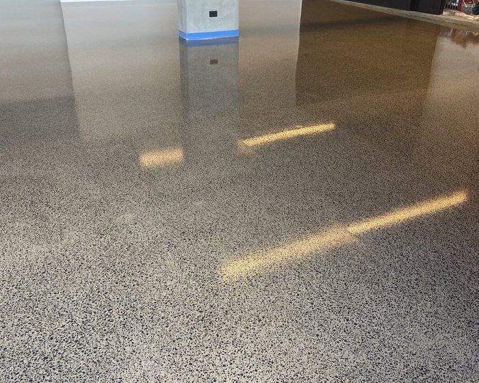 Polished concrete garage floor Polished concrete garage floor with exposed aggregate and a high-gloss finish