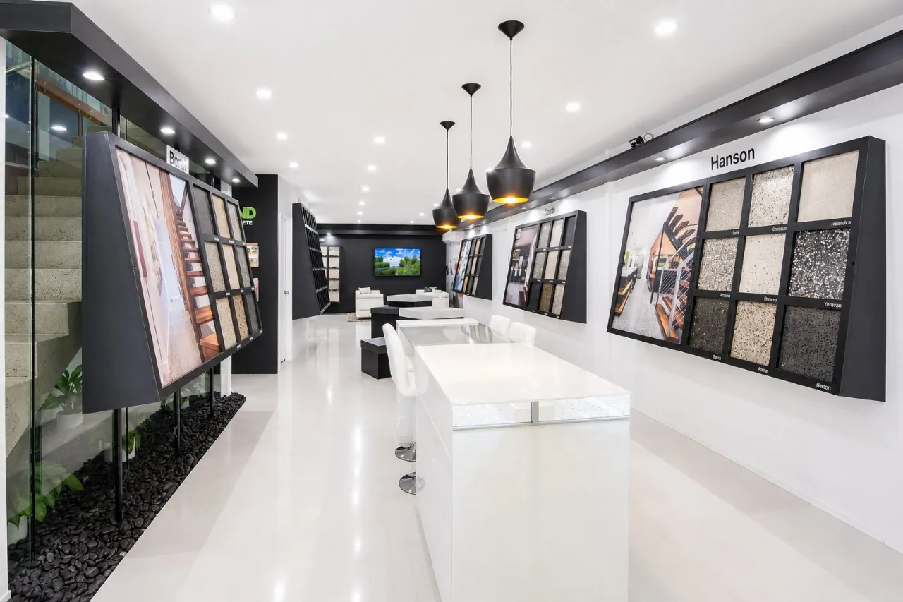 Inside the OzGrind polished concrete showroom in Brisbane with sample display walls