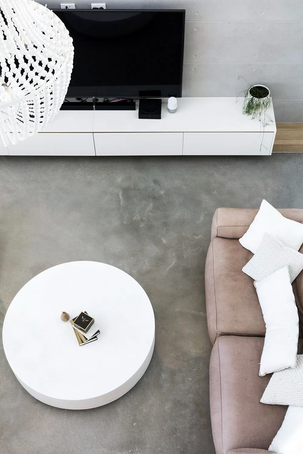 Matte polished concrete floor in the timber kitchen of a Monster Homes residence, Brisbane