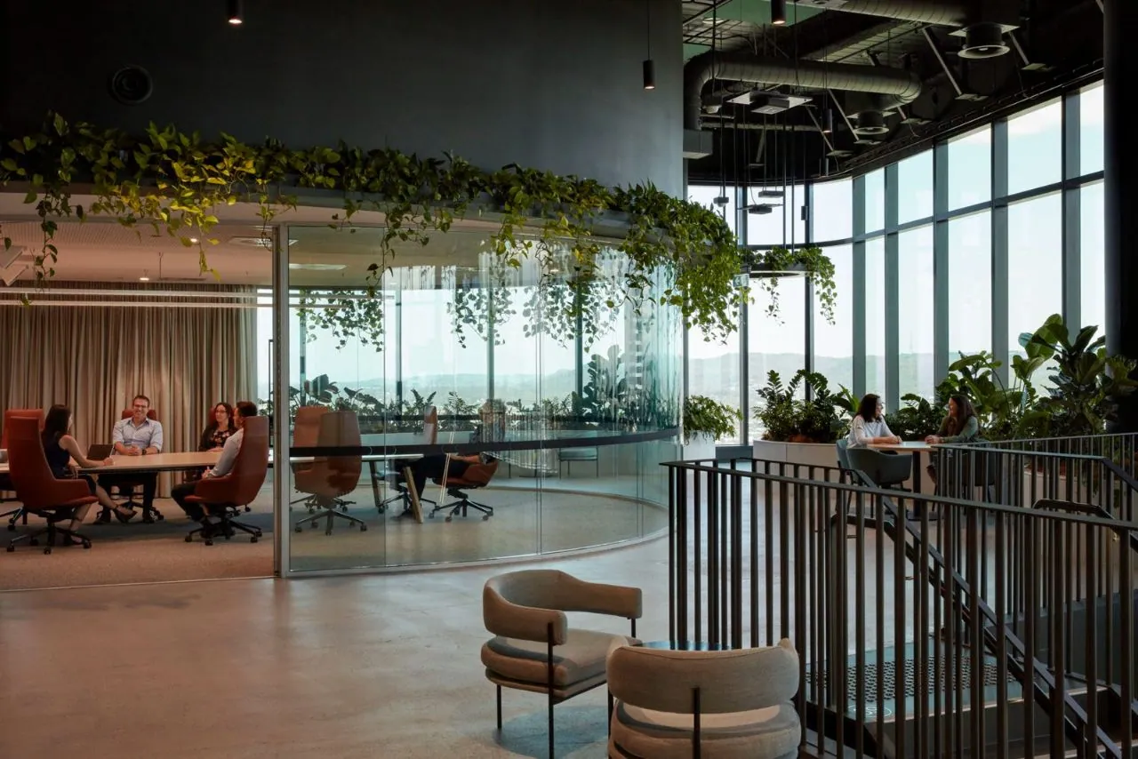Grind and seal matte-satin concrete in a high-rise office with planting and views