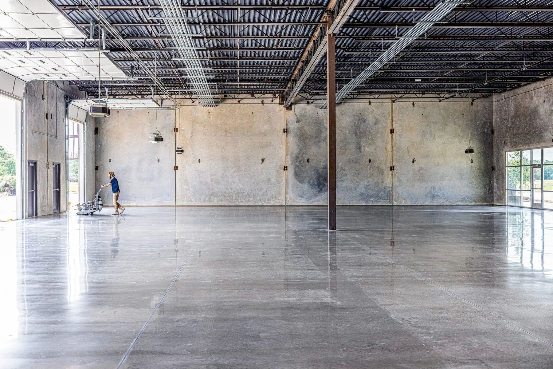 Warehouse floor refurbishment in progress, diamond grinding a warehouse make good in Brisbane Warehouse floor refurbishment in progress, diamond grinding a warehouse make good in Brisbane