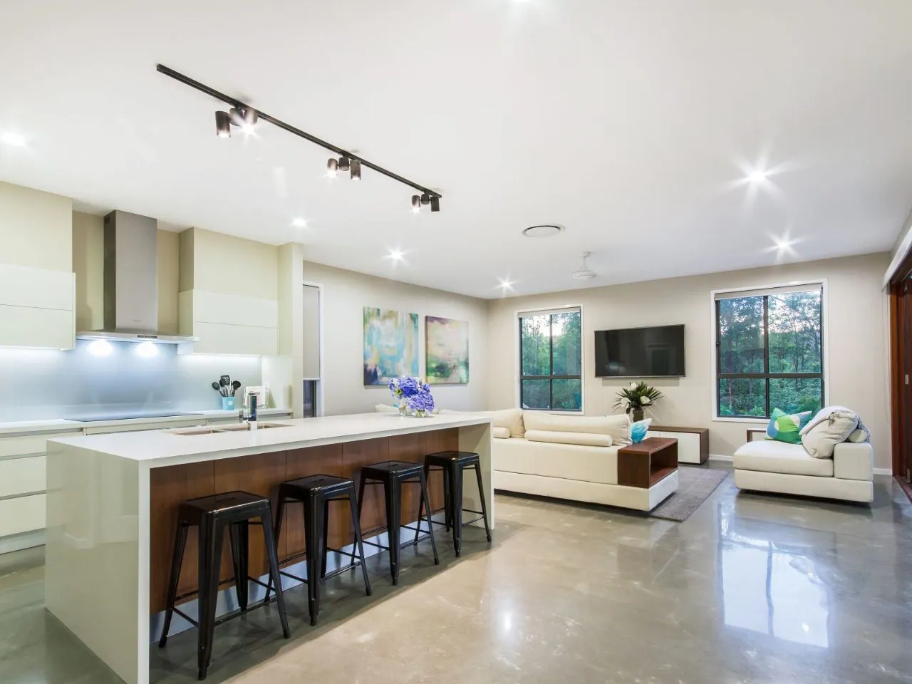 MPC high-gloss polished concrete in a bright kitchen and lounge